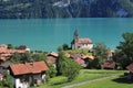 Old church and timber chalets in Brienz, Switzerland. Turquoise water of Lake Brienz Royalty Free Stock Photo
