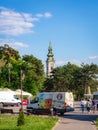 Old church tower in downtown Belgrade with a minibus in the background