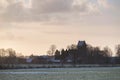 Old church tower of village in rural winter landscape. Geesteren. Achterhoek. Gelderland. The Netherlands.