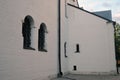 Old church windows decorated by metallic net. Royalty Free Stock Photo