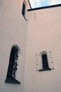 Old church windows decorated by metallic net. Royalty Free Stock Photo