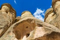 Caves in Fairy Chimneys rock formation Cappadocia Turkey Royalty Free Stock Photo