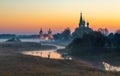 Old churches  at fog sunrise in Dunilovo Royalty Free Stock Photo