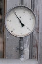Old circular industrial pressure gauge Royalty Free Stock Photo