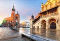 Old city center view with Adam Mickiewicz monument and St. Mary`s Basilica in Krakow on the morning Royalty Free Stock Photo