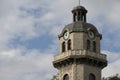 Old city clock tower on a cloudy sky background Royalty Free Stock Photo