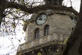 Old city clock tower on a cloudy sky background Royalty Free Stock Photo