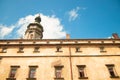 Old city exterior walls and tower foreshortening from below exterior facade background concept with blue sky