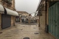 Old City of Jerusalem - Christian Quarter, empty street and square in the morning in rainy weather. Israel