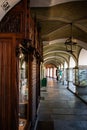 Portico and old historic shops in the Saluzzo old town area. Piemonte, Italy