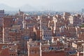 The Old City of Sana'a, decorated houses, palace, minarets and the Saleh Mosque in the fog, Yemen