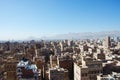 The Old City of Sana'a, decorated houses, palace, minarets and the Saleh Mosque in the fog, Yemen Royalty Free Stock Photo