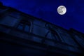 Full moon over the city at night, Baku Azerbaijan. Big full moon shining bright over buildings Royalty Free Stock Photo