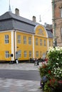 Old City Town Hall. Beautiful historic yellow and white painted building in the city center, Aalborg, Denmark. Royalty Free Stock Photo
