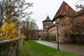 Old city wall with watch towers surrounding medieval city. Royalty Free Stock Photo