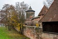 Old city wall with watch towers surrounding medieval city. Royalty Free Stock Photo