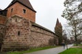 Old city wall with watch towers surrounding medieval city. Royalty Free Stock Photo