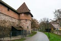 Old city wall with watch towers surrounding medieval city. Royalty Free Stock Photo