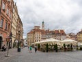 Old city. Warsaw Poland. Multicolored houses. Street with tourists. Warsaw, Poland - August 1, 2023.