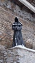 Old City winter Tallinn Christmas time  holiday mood middle ages medieval monk statue Royalty Free Stock Photo