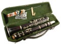 Old clarinet in a case with brush isolated on white Background Royalty Free Stock Photo