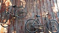 Old classic bicycles hanging on wooden wall. Royalty Free Stock Photo