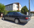 Old classic big luxury coupe car Mercedes Benz E 320 E 320 left side parked