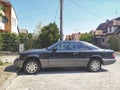Old classic big luxury coupe car Mercedes Benz E 320 left side parked