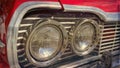 Old and classic car front view and round headlights. Royalty Free Stock Photo