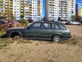 Wreck of old green hatchback car BMW 320 model abandoned Royalty Free Stock Photo