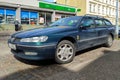 Old classic dark green Peugeot 406 hatchback version left side front view