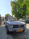 Old classic vintage veteran sedan Italian car Alfa Romeo Giulia 1300 TI right side and front view Royalty Free Stock Photo