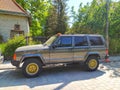 Old classic four wheel drive Jeep Cheerokee private car parked