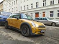 Old gold metallic Morris Mini Cooper private car parked Royalty Free Stock Photo