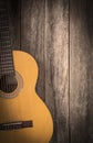 Old classic guitar on a wooden background Royalty Free Stock Photo