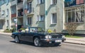 Old vintage veteran classic car white Jaguar convertible driving