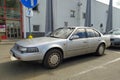 Old classic Japanese sedan car Nissan Maxima parked