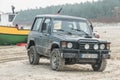 Old classic Mitsubishi Pajero 4WD car parked on a beach