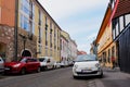 old classic narrow european street alley. parked cars along the sidewalk. Budapest streetscape Royalty Free Stock Photo