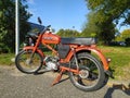 Old classic orange Polish Romet moped parked Royalty Free Stock Photo