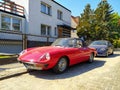 Old classic roadster sports car Alfa Romeo Spider 2000 left side and front part parked Royalty Free Stock Photo