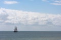 Old classic ship sailing in the ocean with beautiful background of clouds Royalty Free Stock Photo