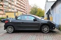 Old black Peugeot 206 CC coupe cabriolet or convertible with retractable hardtop two door private car parked