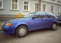 Old classic small car blue Suzuki Swift parked