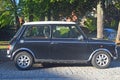 Old classic small car Morris Mini Cooper parked