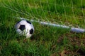 Old and classic Soccer ball or football ball on green field Royalty Free Stock Photo