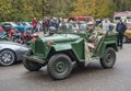 Old classic Soviet Army military car GAZ at a car show