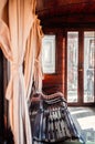 Old classic train wooden interior with curtain and afternoon light