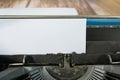 An old classic typewriter on wooden desk. Copy space. For text purpose. Royalty Free Stock Photo