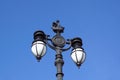 Old classic urban public lighting and blue sky